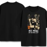 Czarny T-shirt Nie Mogę Kot Na Mnie Leży z przodu ilustracją kobiety i kota – humorystyczny merch dla cat loverów, bawełniany z leniwym vibe, na relaksowe dni.